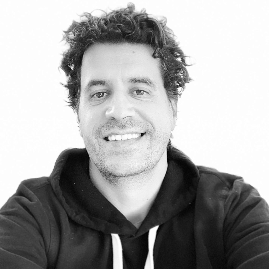 Headshot of Sean Sweeney in a black hoodie