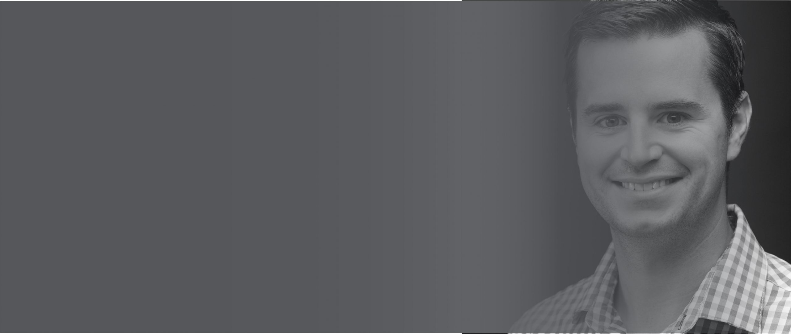 Headshot of Joe Pohlen, smiling in a collared shirt and tie with an orange microphone to the left of the image